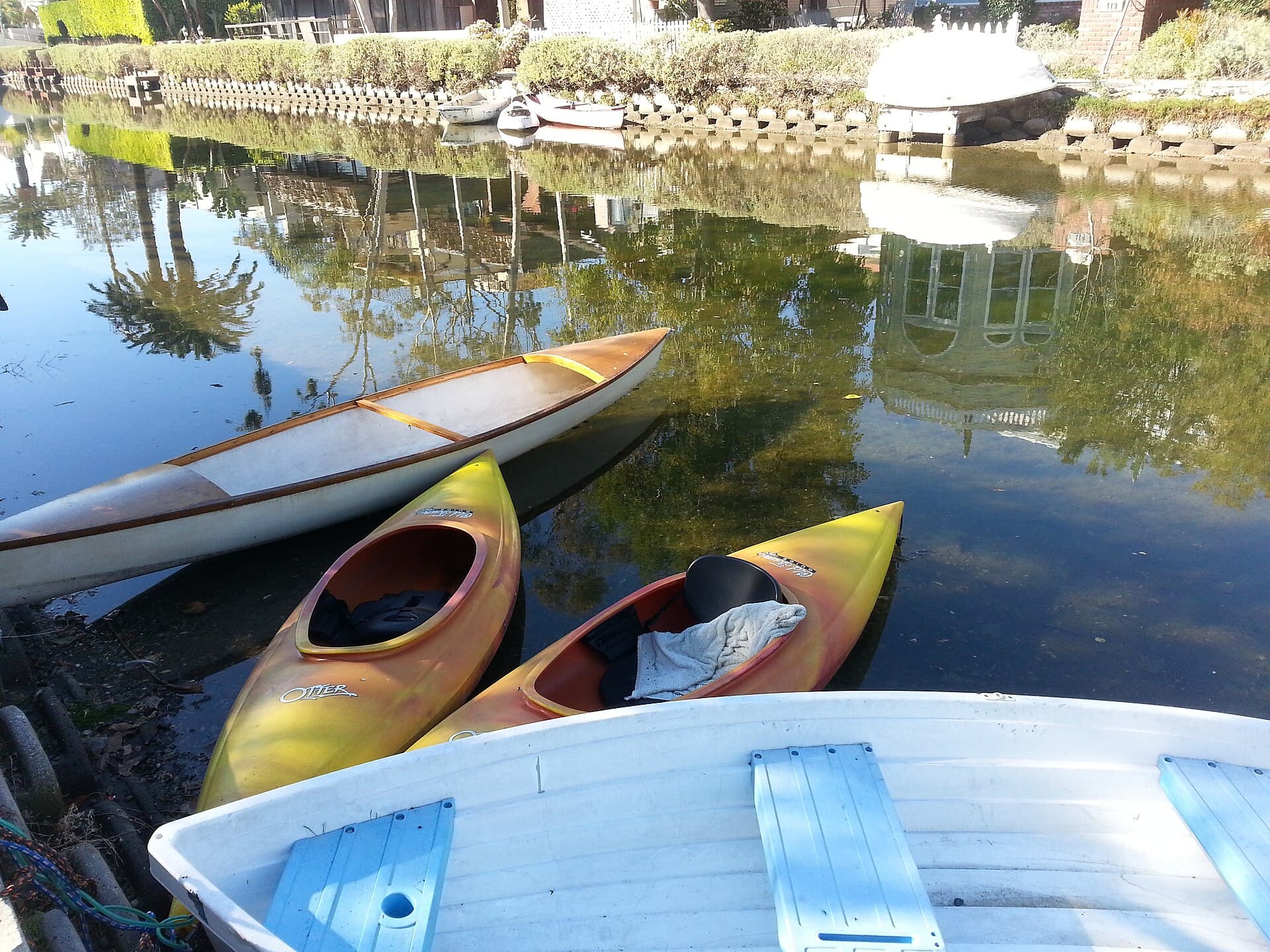 Small boats and homes along Sherman Canal in the Venice Canal Historic District